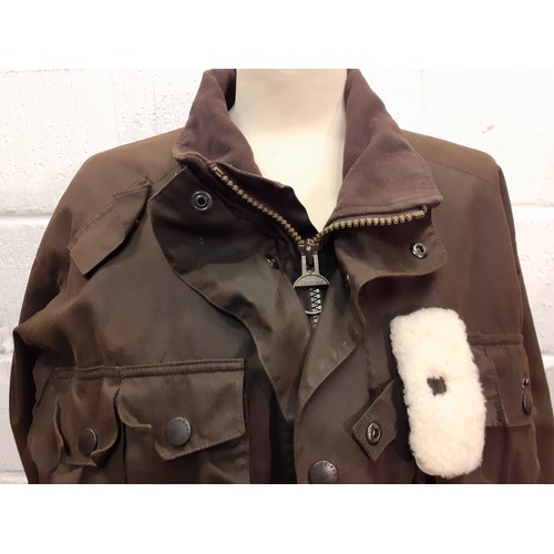33 - Barbour-A brown breathable wax cotton country pursuit jacket having a brown felt collar and drawstri... 