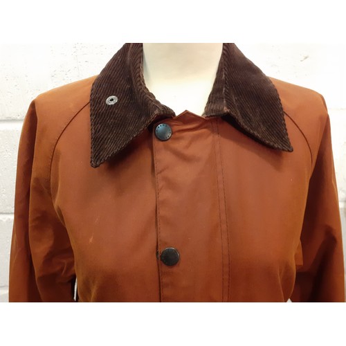 35 - Barbour-A chestnut brown Beaufort wax cotton coat with brown cord collar, having 2 front deep pocket... 