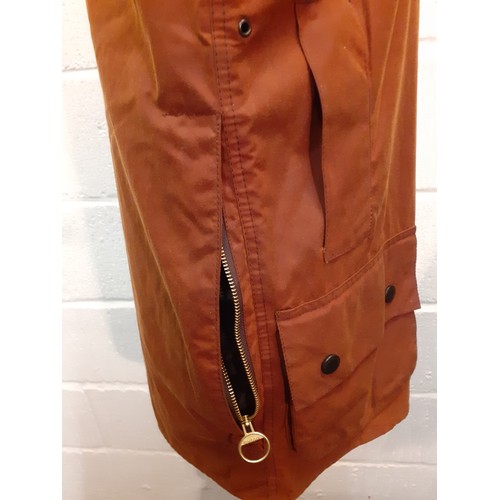 35 - Barbour-A chestnut brown Beaufort wax cotton coat with brown cord collar, having 2 front deep pocket... 