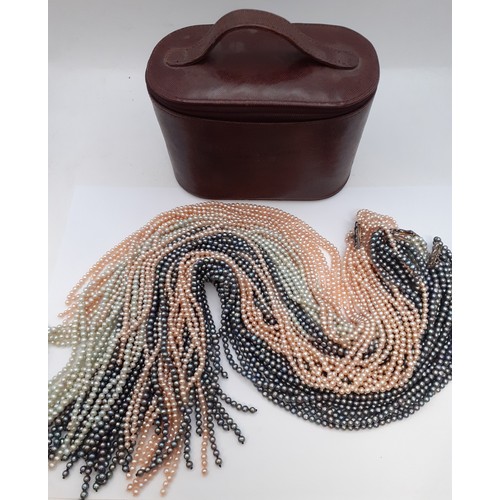 79 - An interchangeable pearlized scarf of beads together with a Penhaligon's burgundy leather case. Loca... 