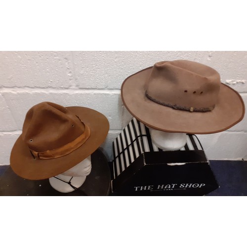 73 - A group of four 20th Century hats comprising 2 straw boaters and 2 wide brim brown felt hats to incl... 