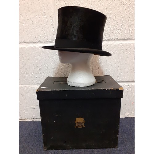 72 - An early 20th Century Lincoln Bennett & Co black brushed silk top hat having a cream silk lining and... 