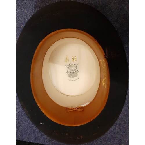72 - An early 20th Century Lincoln Bennett & Co black brushed silk top hat having a cream silk lining and... 