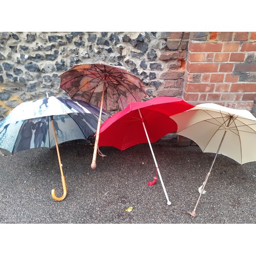 71 - Four vintage umbrellas comprising a Paragon S.Fox & Co red example with white wooden handle having a... 