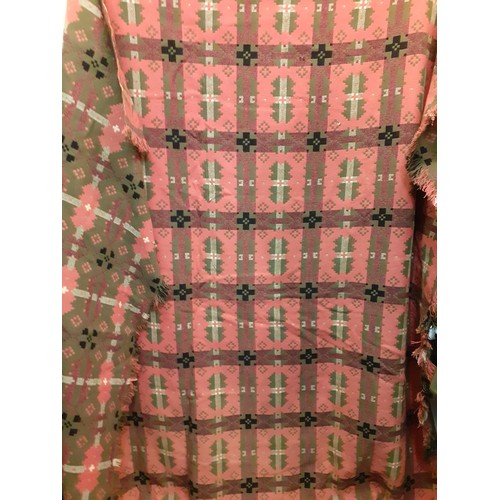 70 - A vintage pink, green, black and white Welsh wool blanket with geometric design having a fringe to 2... 