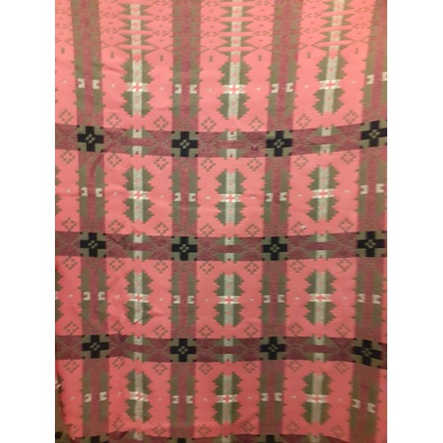 70 - A vintage pink, green, black and white Welsh wool blanket with geometric design having a fringe to 2... 