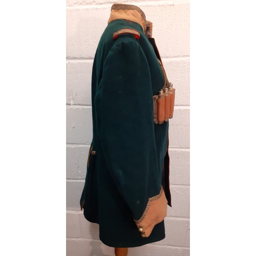 66 - An early 20th Century Russian Cossack Chokha green felt tunic A/F having a traditional Gazyrs cartri... 