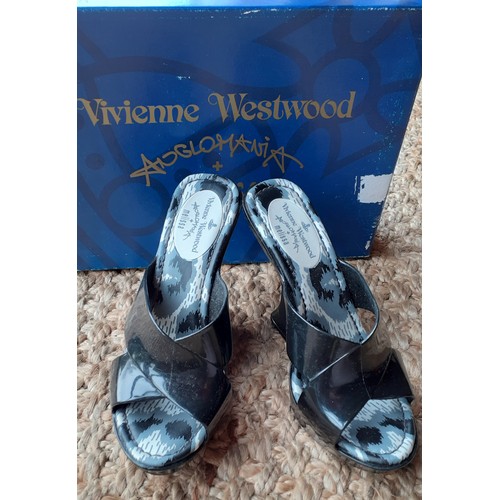 18 - Vivienne Westwood-A pair never worn black rubber wedge VW Melissa shoes, UK size 4 with original sho... 