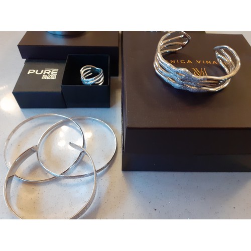 83 - A group of modern silver and silver tone jewellery to include 3 Monica Vinader silver bracelets; one... 