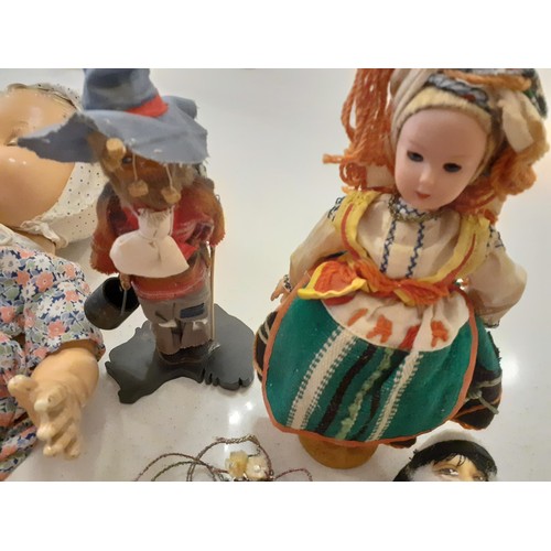 84 - A collection of vintage dolls of the world to include a Chad Valley rag doll with green checked dres... 