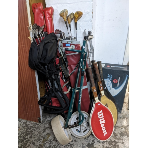 478 - Sporting equipment to include J S Easey ladies wooden clubs, and other irons in a red golf bag and a... 