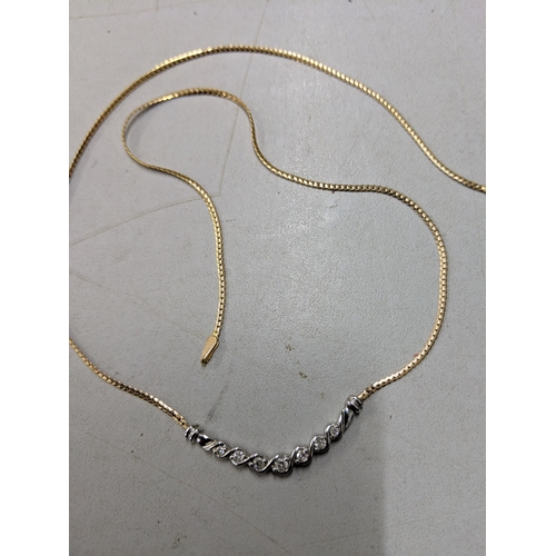 78 - A 9ct yellow and white gold necklace inset with seven diamonds 3.9 grams together with a 1985 Austra... 