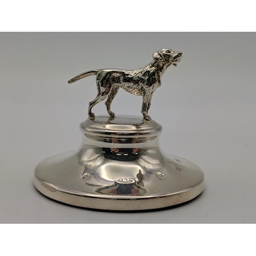 81 - A pair of silver candlesticks and silver paperweight surmounted by a dog, combined weight 514.9g Loc... 