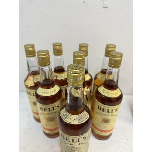 156 - Eight bottles of Bells Old Scotch Whisky, 7 x 75cl, 1 x 26 2/3 fl oz 
Location: S1.2