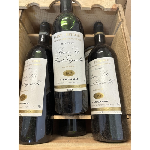 149 - A cased six bottle of Chateau Beau-Site Haut-Vignoble 1983, Saint Estephe Location: ABOVE SHELF 1