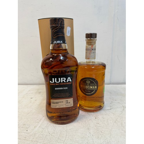 115 - A single bottle of The Woodsman blended Scotch Whisky 70cl and one boxed bottle of Jura Bourbon Cask... 