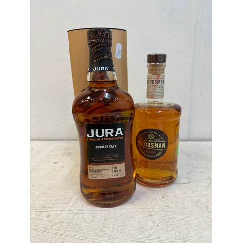 115 - A single bottle of The Woodsman blended Scotch Whisky 70cl and one boxed bottle of Jura Bourbon Cask... 