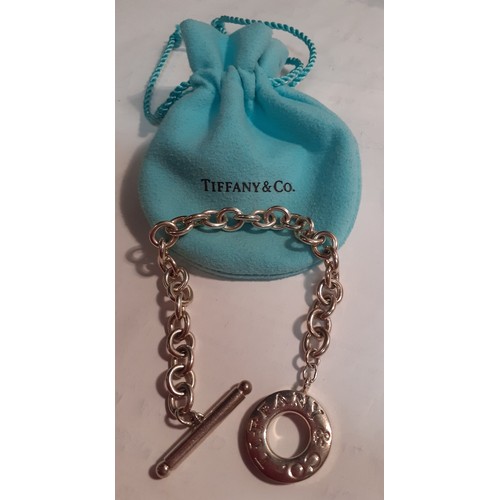 11 - Tiffany & Co-A silver open chain bracelet, the chain measuring 15cm long, weight 24.1g with branded ... 