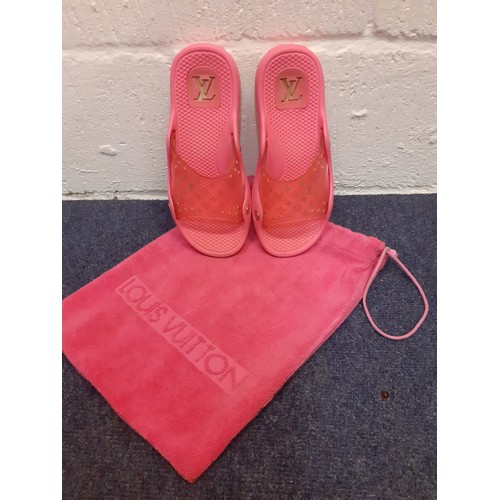 44 - Louis Vuitton-A pair of pink monogram rubber slider mules, European size 38 with pink branded towell... 