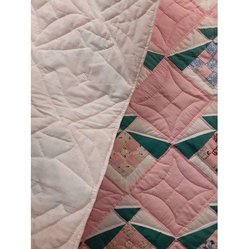 90 - A late 20th Century American Mid West double layer handmade patchwork quilt in a diamond shaped desi... 