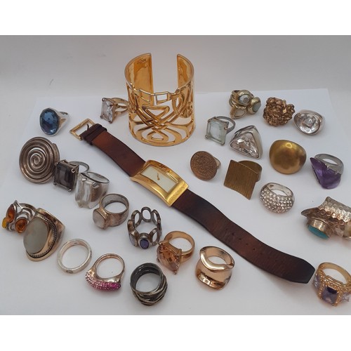 95 - Modern costume jewellery to include a Biba gold tone bangle, a DKNY gold tone ladies watch with brow... 