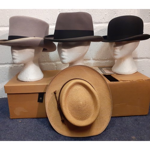 87 - Four gents hats comprising a late 20th Century Windmill Textiles grey felt top hat with black band s... 