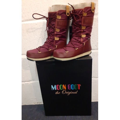 107 - A pair of waterproof/snow proof burgundy 'Monoco' Moonboots, unworn, new with original tags and box,... 