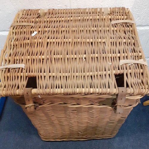 110 - A vintage laundry basket with leather straps, 60