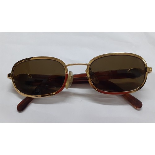 108 - Rochas-A pair of vintage gold tone sunglasses, model 90778 with green lenses and tortoiseshell effec... 