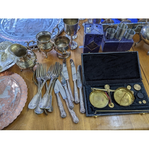 106 - A mixed lot of silver plate, metal wares and other items to include a boxed set of six onyx goblets,... 