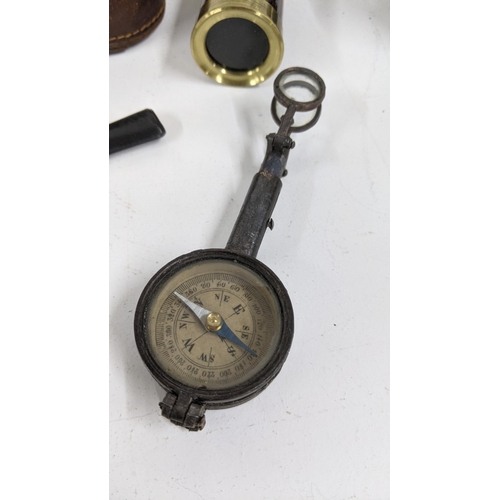 135 - A mixed lot to include an early 20th century combined emergency compass, along with a pair of World ... 