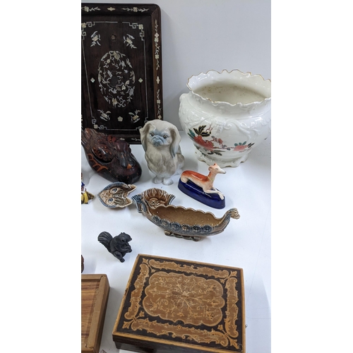 164 - A mixed lot to include a Lladro Pekingese dog, Staffordshire greyhounds, Wade, mother of pearl inlai... 