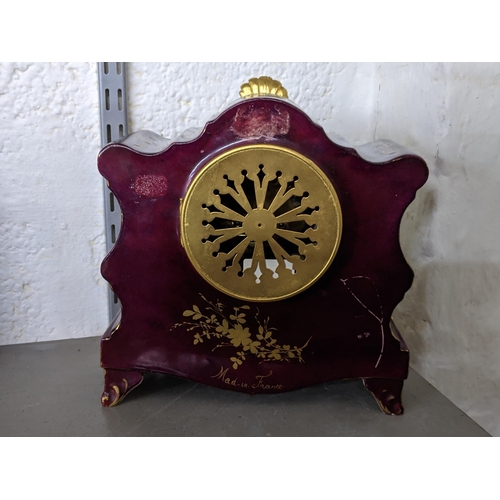 174 - An early 20th century French porcelain mantel clock having gilt metal mounts, and an 8-day movement ... 