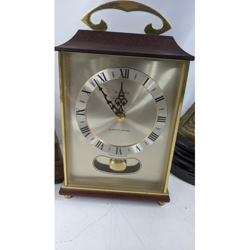 38 - An Edwardian Napoleon hat mantle clock having inlaid detail, together with an anniversary clock and ... 