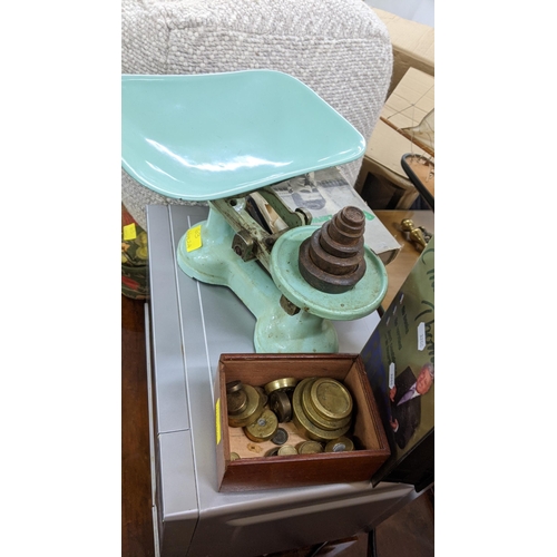 63 - A mixed lot to include a Panasonic 800w microwave, vintage weighing scales with various brass weight... 