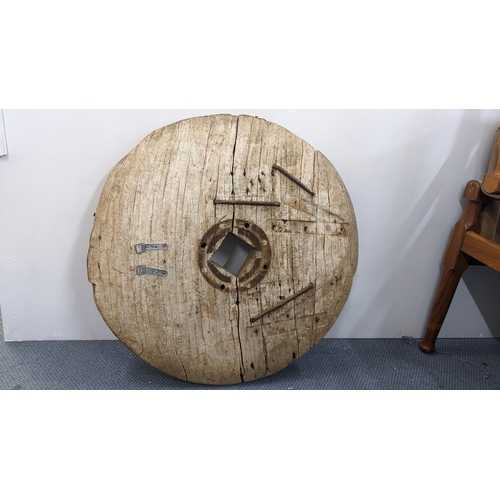 65 - An antique wall mounted wheel, possibly a Japanese ox cart wheel, 76cm diameter
Location:A4F