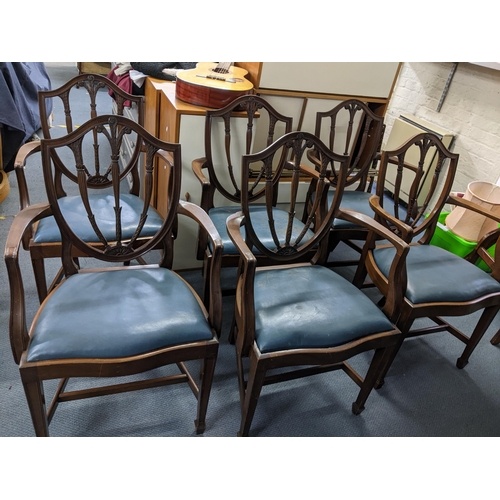 79 - Set of six mahogany shield back carved dining chairs with leather upholstered drop in seats, Locatio... 