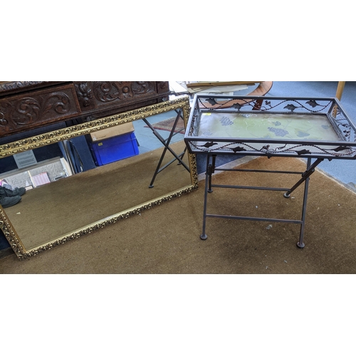 86 - A painted metal folding tray topped table, having grape and wine leaf decoration, 57 x 63 x 41cm, al... 