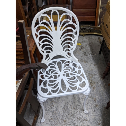 74 - A white painted metal garden table and four garden chairs, Location:G