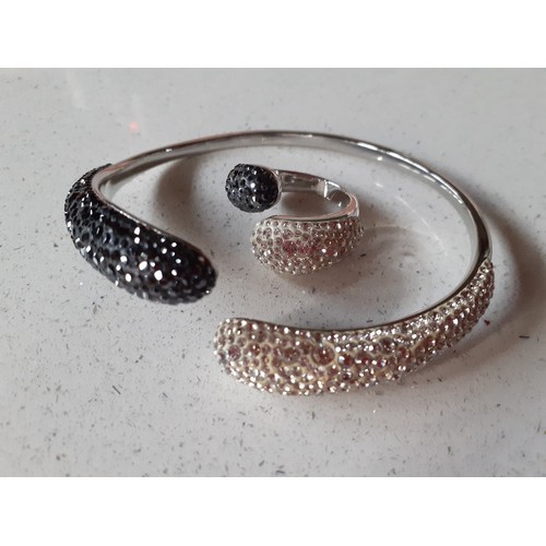 128 - Modern costume jewellery, mainly bracelets to include a silver tone Swarovski two tone crystal open ... 