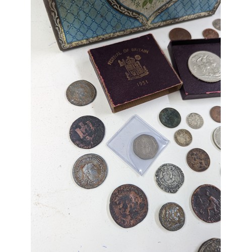 140 - Numismatic Interest - A coin collection album, presentation case, cash tin, along with a mixed group... 