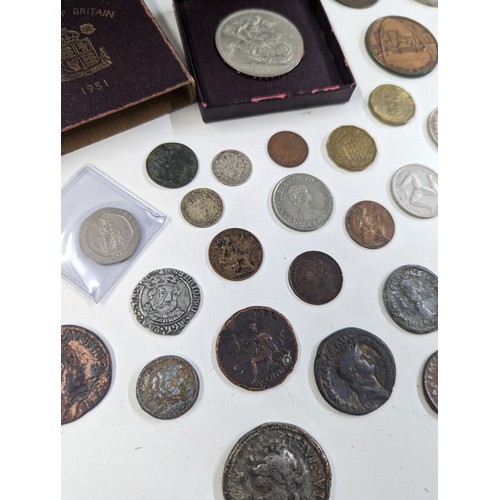 140 - Numismatic Interest - A coin collection album, presentation case, cash tin, along with a mixed group... 