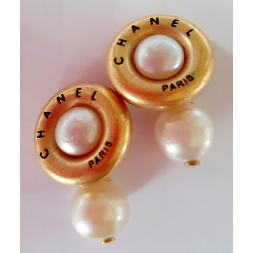 3A - Chanel- A pair of 1994 Autumn Collection gold tone and pearl cufflinks, stamped Chanel 94 P Made In ... 