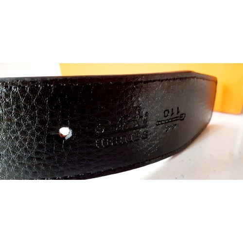 13 - Hermes- A brand new gents Togo grain reversible noir/orange leather belt having a brushed gold tone ... 