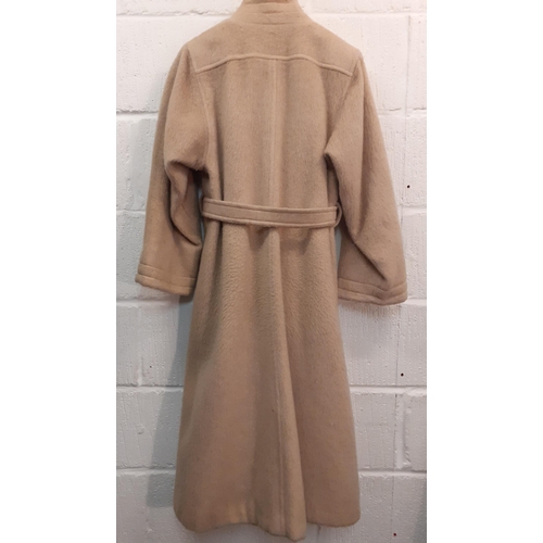 175 - A vintage Wallis beige wool mix ladies swing coat having 2 front pockets, matching belt and buttoned... 