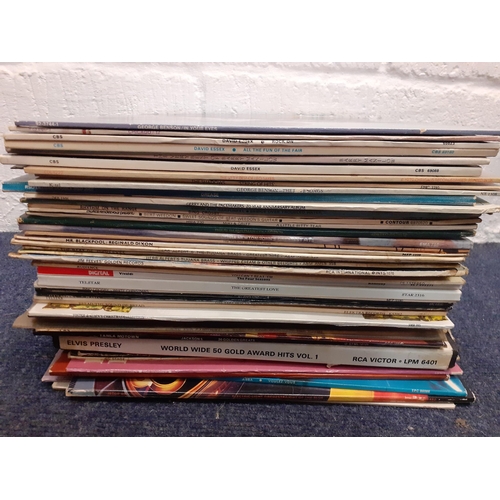 202 - A quantity of LP's, mainly late 1970's to include easy listening, George Benson, Barry Manilow, Davi... 