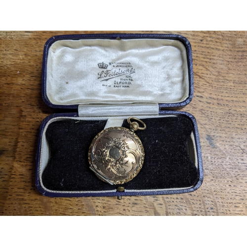 272 - A late 19th/early 20th century gold plated locket, in a L Feitelson, Ilford jewellery box, weight of... 