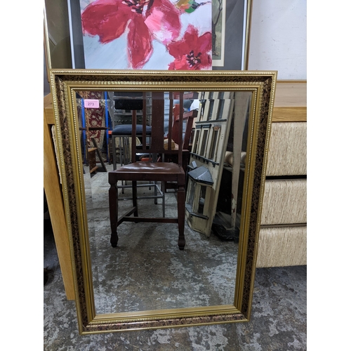 273 - A contemporary gilt framed wall mirror with rectangular bevelled glass plate, 86cm x 60.5cm
Location... 