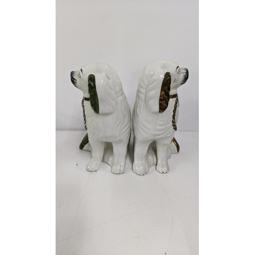 322 - A pair of Victorian Staffordshire king Charles Spaniels 24cmH together with character jugs, an 18th ... 