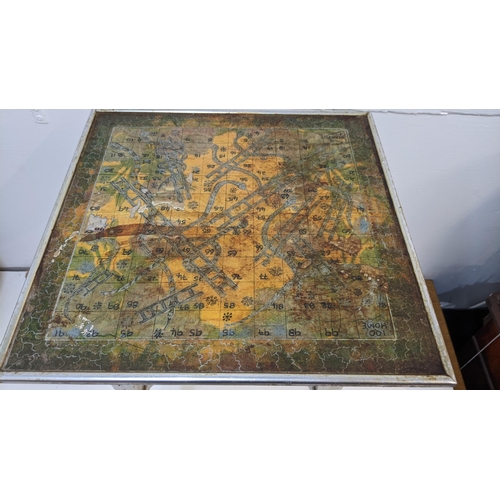 339 - A vintage metal framed table with a jigsaw picture style top
Location: RAB